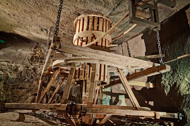 Underground corridor with wooden machine for pulling mine carts, Wieliczka Salt Mine, Poland.