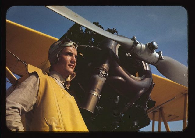 Marine lieutenant by the power plane which tows the training gliders at Page Field, Parris Island, S.C. (LOC).
