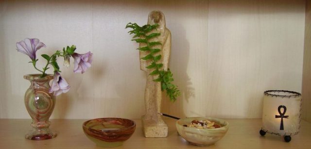 Private altar of a practitioner in the Czech Republic, with a statue representing Thoth featured prominently.
