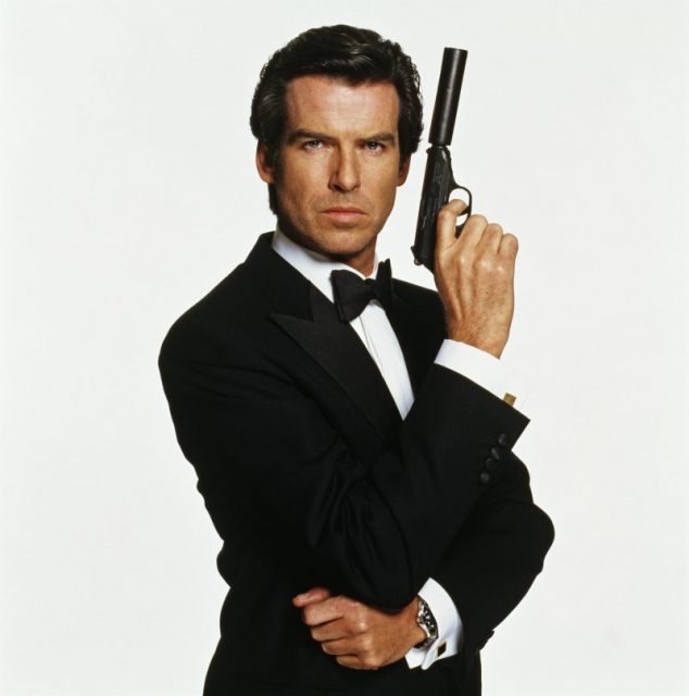 Irish actor Pierce Brosnan as James Bond, in a publicity still for the film ‘GoldenEye’, c. 1995. He is holding his iconic Walther PPK with a silencer. Photo by Terry O’Neill/Iconic Images/Getty Images