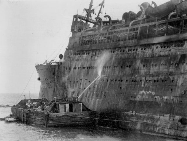 S.S. Morro Castle disaster in Spring Lake, New Jersey, Tons of water are poured into Morro Castle from barge. Photo by NY Daily News Archive via Getty Images