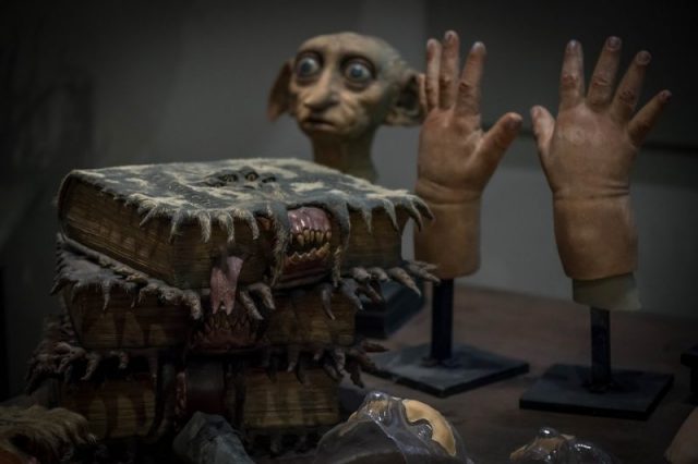 Harry Potter movie props – magical books and Dobby the House Elf.