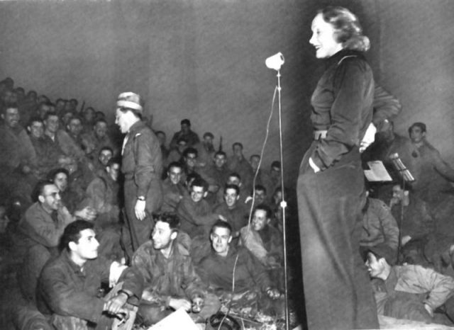Marlene Dietrich, entertaining front-line soldiers of the Third Army, 1944.