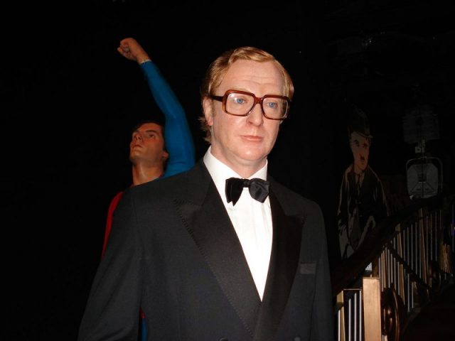 A wax sculpture of Caine in his Harry Palmer character from The Ipcress File, at Madame Tussauds, London. Photo by mwanasimba Mme Tussaud museum CC BY-SA 2.0