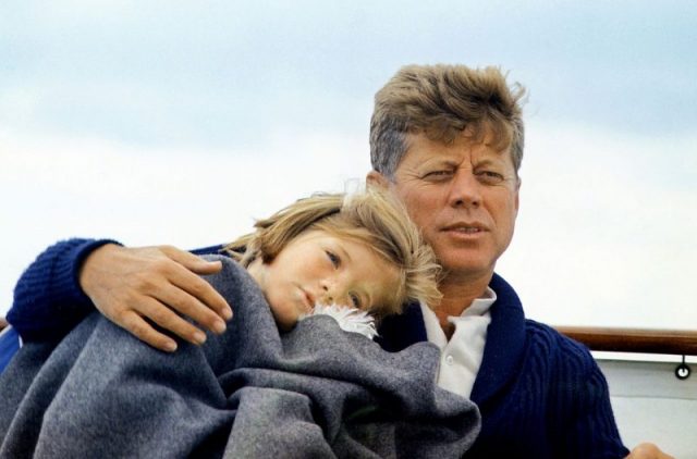 Caroline with her father aboard the yacht Honey Fitz off the coast of Hyannis, Massachusetts at age five, August 25, 1963.
