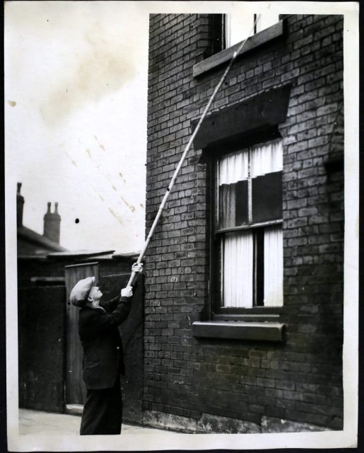 Mr Crompton, the oldest knocker-up, at work in Bolton, Bolton. Photo by Hulton Archive/Getty Images