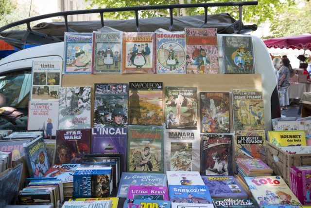 Aix-en-Provence, France – May 31, 2014: A variety of French-language books are for sale at the popular Saturday market in Aix-en-Provence, France.