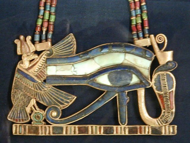 An Eye of Horus or Wedjat pendant.