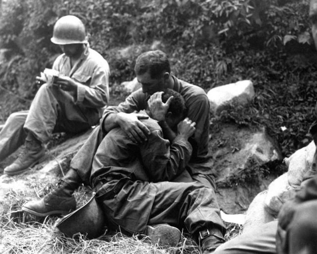 G.I. comforting a grieving infantryman