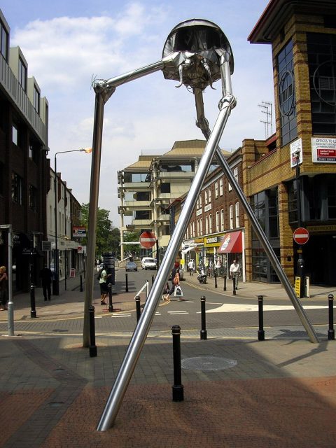Statue of a tripod from The War of the Worlds in Woking, England. The book is a seminal depiction of a conflict between mankind and an extraterrestrial race. Photo by Warofdreams CC BY-SA 3.0