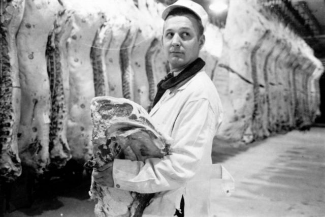 Butcher holding slab of beef in a meat locker, 1949. Image from Look photographic assignment ‘Chicago City of Contrasts’ by S. Kubrick.