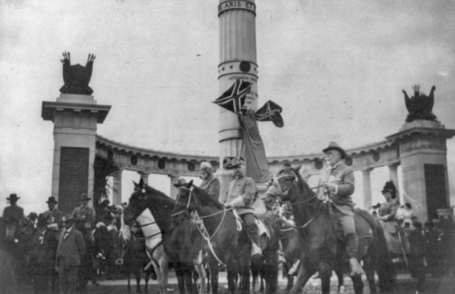 George Washington Custis Lee, on horseback, with staff reviewing Confederate Reunion Parade in Richmond, VA., June 3, 1907, in front of monument to Jefferson Davis