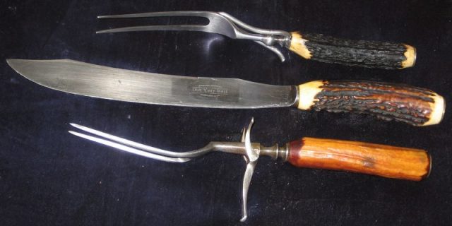 Old carving knife and carving forks, non-stainless steel. Stag handles. Note folding fork guards. Photo by David R. Ingham CC BY-SA 3.0