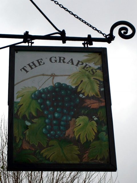 The pub sign of The Grapes, Limehouse. A bunch of grapes, as you’d expect. Photo by Ewan Munro CC BY-SA 2.0