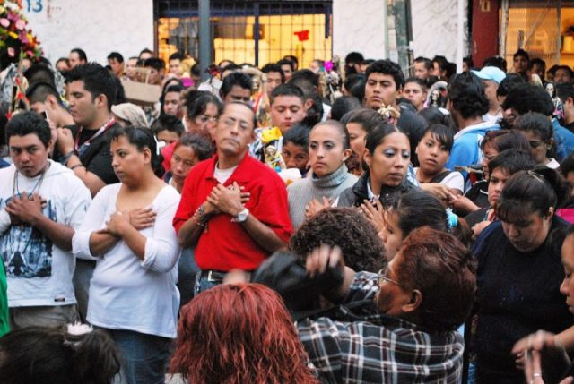 Devotees praying to Santa Muerte, Mexico. Photo by Thelmadatter CC BY-SA 3.0
