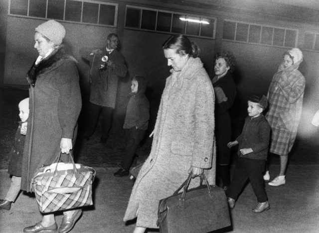 Escape from East Berlin after the construction of the Berlin Wall: train with which the engine driver Harry Deterling, the fireman and 25 relatives of them escaped to West Berlin (Spandau) (the train rode from Oranienburg to Spandau without stopping) – the refugees on their arrival in Berlin-Spandau (Photo by Schöne/ullstein bild via Getty Images)