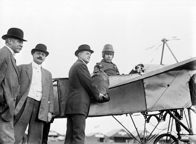 The pilot poses after the the first official airmail flight