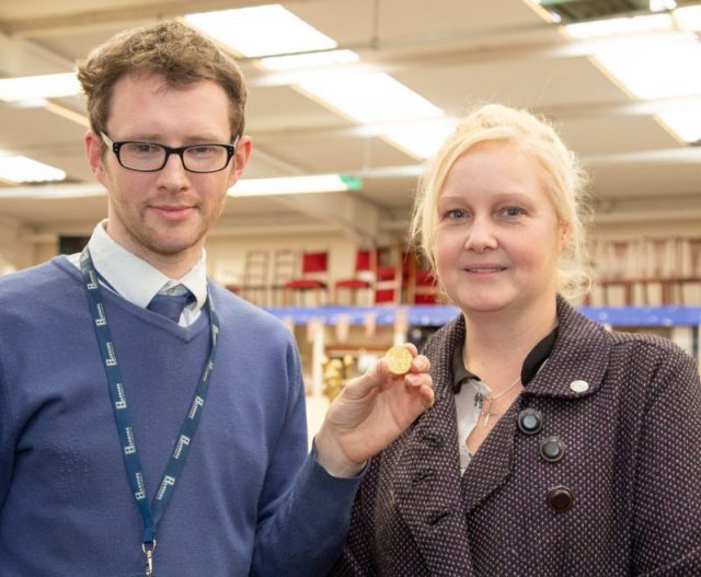 Hansons furniture valuer Edward Rycroft with coin and Amy Clapp. Photo courtesy of Hansons Auctioneers