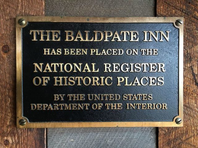 National Register of Historic Places metal plaque. Photo by Nora Lockshin CC BY-SA 4.0
