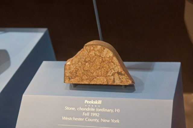 Peekskill meteorite in the National Museum of Natural History. The meteorite hit a parked car in Peekskill, New York in 1992. Photo by Wknight94 CC BY-SA 3.0