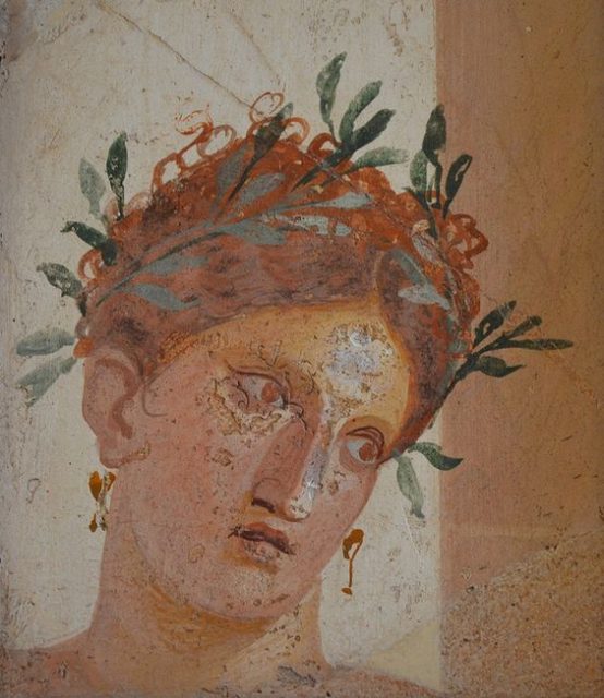 Roman fresco of a woman with red hair wearing a garland of olives, from Herculaneum, made sometime before the city’s destruction in 79 AD by Mount Vesuvius (which also destroyed Pompeii).
