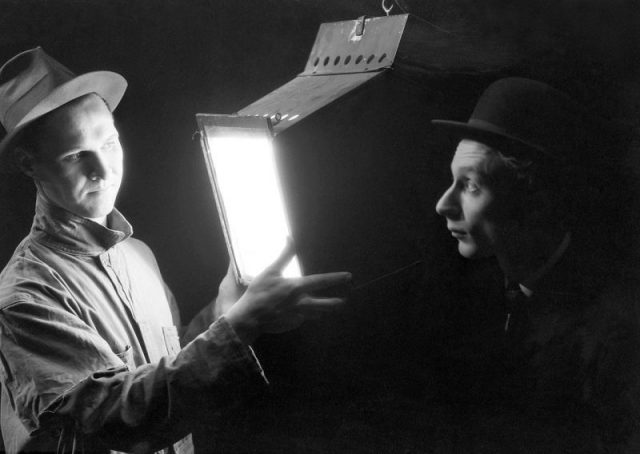 The Man Who Knows All (Robert Noack) explains the kilowatt hour to the Consumer (Lloyd) in ‘Power’, a Living Newspaper play for the Federal Theater Project (1937)
