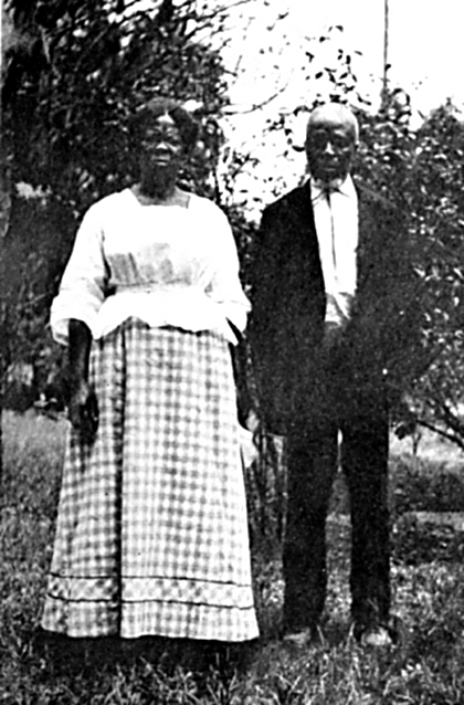 Cudjo Kazoola Lewis photographed with Abache (Clara Turner) by Emma Roche, c. 1914. By then there were eight surviving members of the Clotilda group.