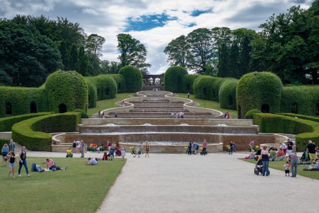 Alnwick Garden – July 31, 2018: a cascade in the contemporary pleasure gardens adjacent to Alnwick Castle in Northumberland county in the UK