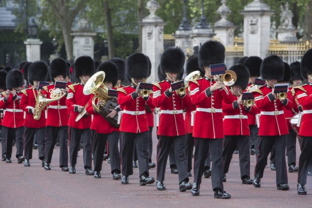 London, England – June 16, 2012: Queens Guard marching band passing Buckingham Palace as part of the Trooping the Colour ceremony