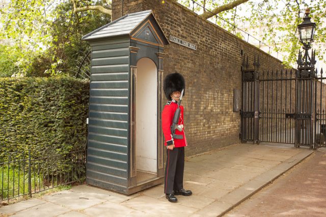 Queens Guard on duty at the entrance to Clarence House, London, England