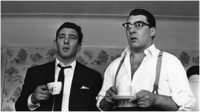 London gangsters Ronnie and Reggie Kray refresh themselves with a cup of tea. They had just spent 36 hours being questioned by the police about the murder of George Cornell. Photo by William Lovelace/Daily Express/Hulton Archive/Getty Images