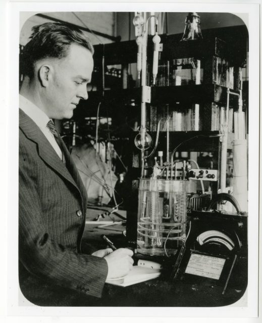 E. C. White demonstrating the use of an apparatus for the automatic analysis and indication of the carbon monoxide content of a gas stream