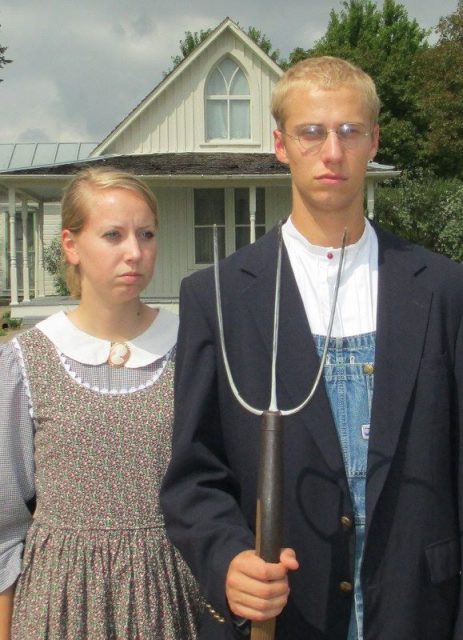 Visitors dress up for photographs outside the American Gothic House in Eldon, Iowa. Photo by Luke.johanson CC BY-SA 3.0