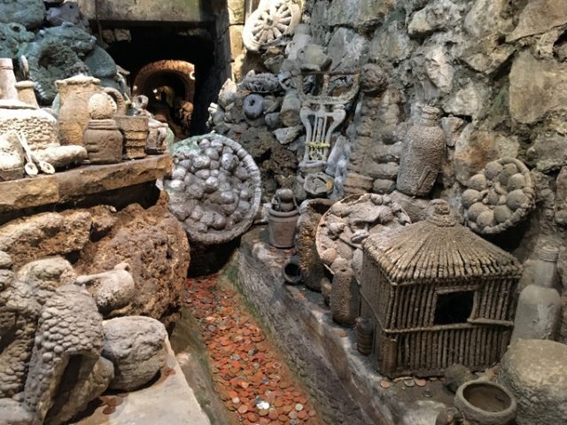 The Petrifying Well at the Matlock Bath Aquarium with objects that have been coated by minerals from the water.