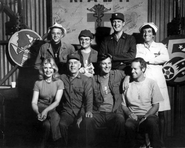 The cast of M*A*S*H from Season 6, 1977 (clockwise from left): William Christopher, Gary Burghoff, David Ogden Stiers, Jamie Farr, Mike Farrell, Alan Alda, Harry Morgan, Loretta Swit.