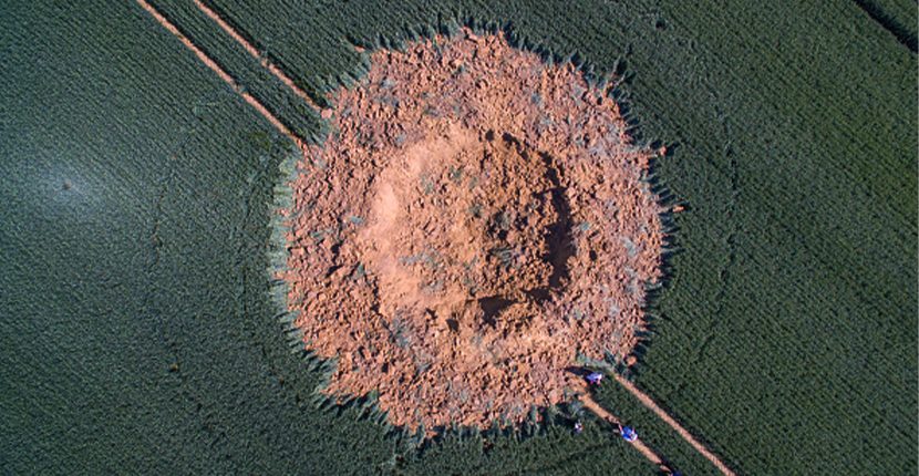 The WW2 bomb exploded underground and produced this result in the German field. BORIS ROESSLER/AFP/Getty Images