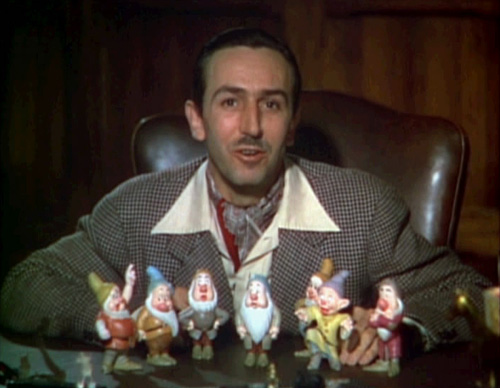 Walt disney introduces each of the seven dwarfs in a scene from the original 1937 snow white theatrical trailer.