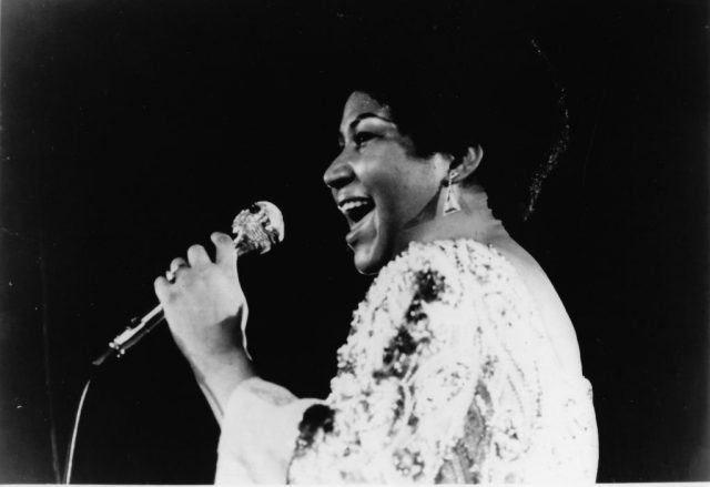 Aretha Franklin performs on stage in 1970 in the United States. (Photo by Gilles Petard/Redferns)