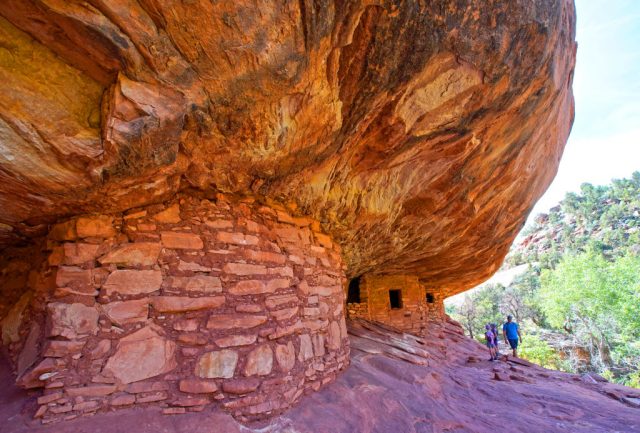 Hikers look around the House on Fire Indian ruins in Mule Canyon, which is part of the Bears Ears National Monument on June 14, 2019 outside Blanding, Utah. The controversial and newly created Bears Ears National Monument contains thousands of ancient Indian artifacts. (Photo by George Frey/Getty Images)