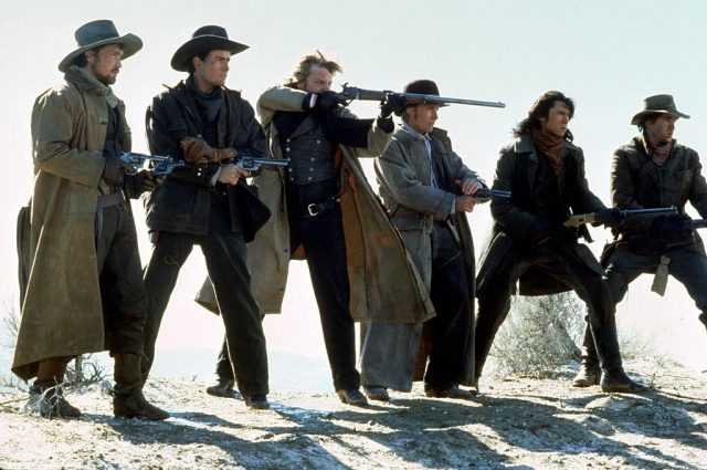 1988: From left to right, actors Casey Siemaszko , Charlie Sheen, Kiefer Sutherland, Emilio Estevez, Lou Diamond Phillips and Dermot Mulroney star in the film ‘Young Guns’. (Photo by Michael Ochs Archives/Getty Images)