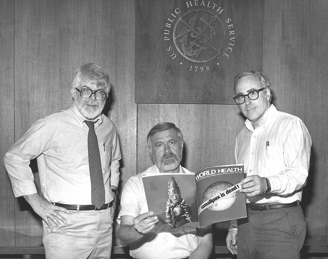 Three former directors of the Global Smallpox Eradication Program as they read the good news that smallpox had been eradicated on a global scale.