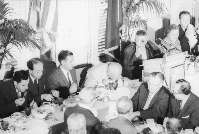 Nikita Khrushchev eating a melon at the National Press Club lunch.