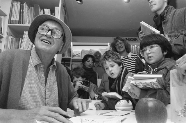 Roald Dahl signs books for children.