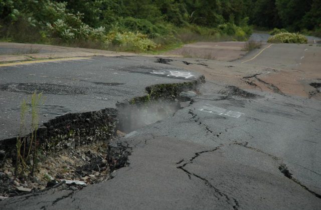 A highway with smoke seeping from the cracks in Centralia, Pennsylvania