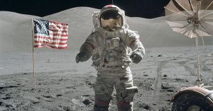 Commander Eugene Cernan on the moon during the Apollo 17 mission, with equipment and the US Flag in the background