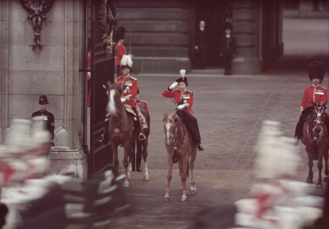 Queen Elizabeth II and The Prince Philip, Duke of Edinburgh (left) taking a salute during a Trooping of the Colour ceremony outside Buckingham Palace.