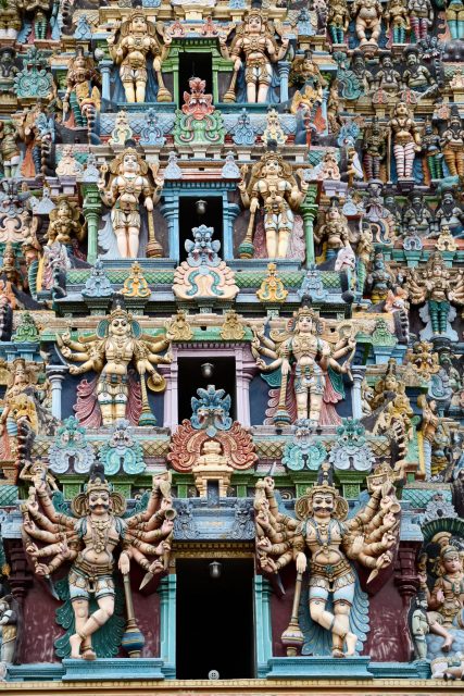 Example of the colorful statues carved in the towers of the Meenakshi Temple. (Photo Credit: Frédéric Soltan/ Getty Images)
