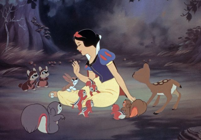 Snow White surrounded by forest animals