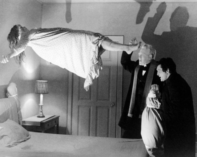 An exorcism being performed on Regan in The Exorcist