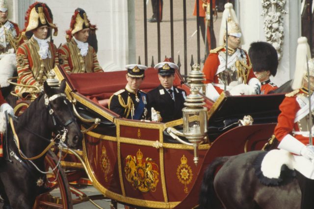 Prince Charles and Prince Andrew riding in a carriage